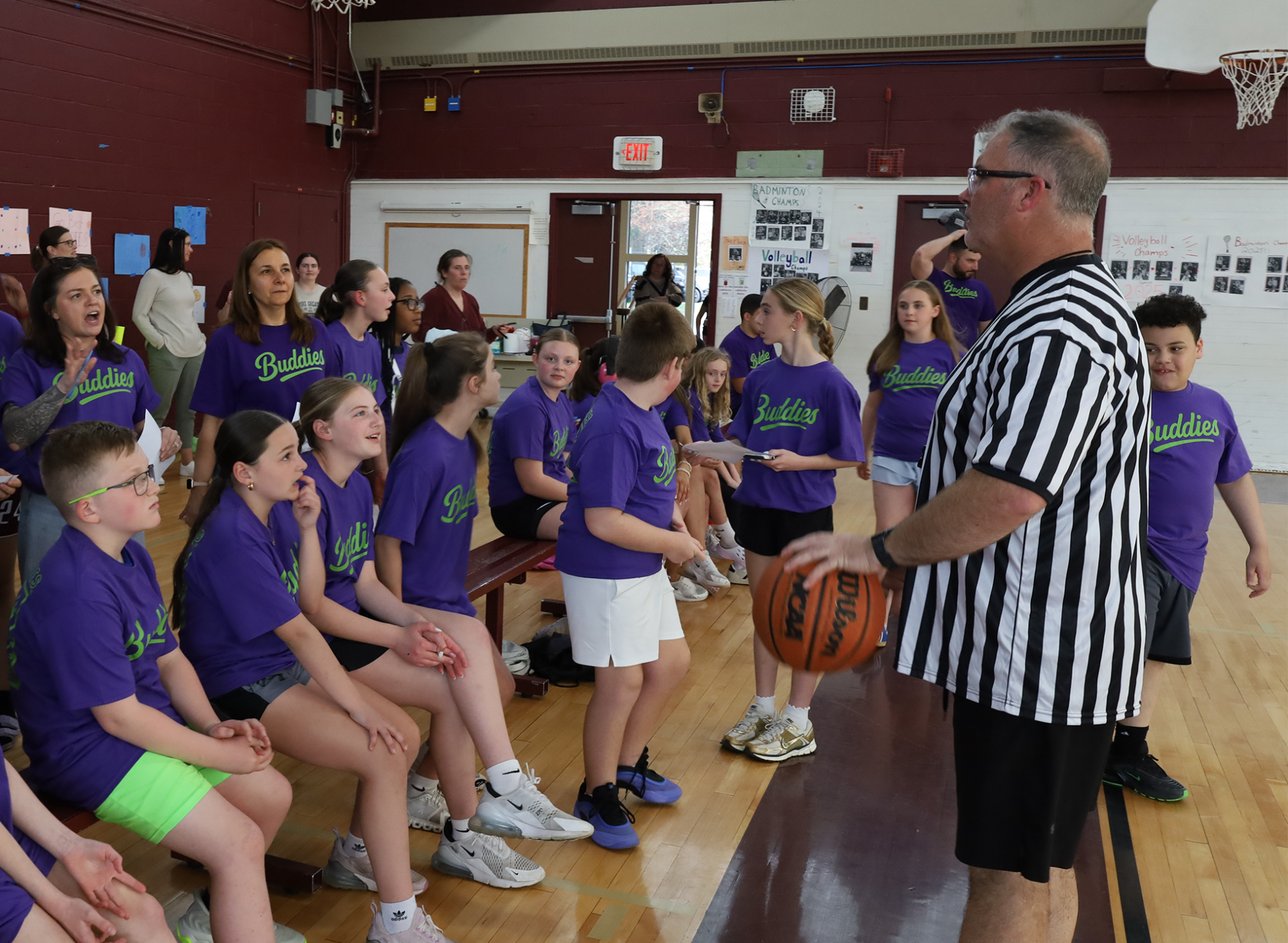 The referee discusses the rules with the Parker Middle School Best Buddies prior to the second annual Buddies vs. Badges charity basketball game on April 16, 2026.