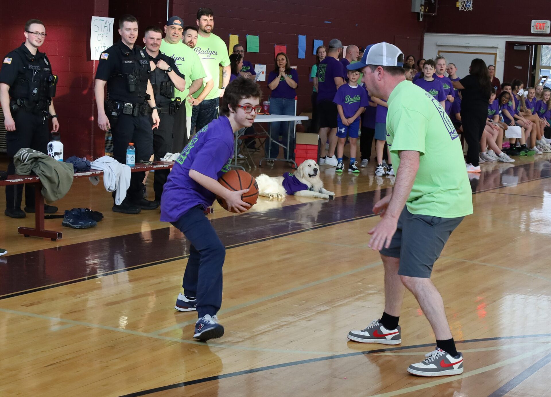 Action from the second annual Buddies vs. Badges charity basketball game on April 16, 2026.