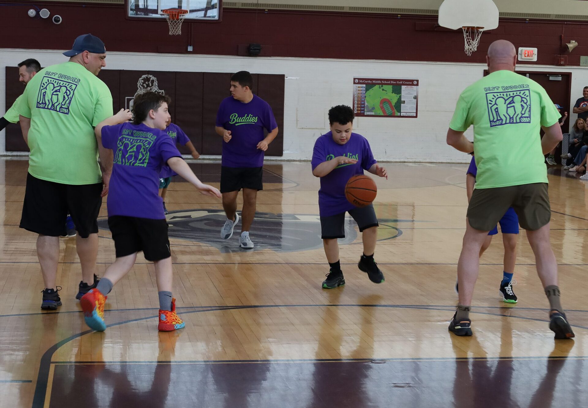 Action from the second annual Buddies vs. Badges charity basketball game on April 16, 2026.
