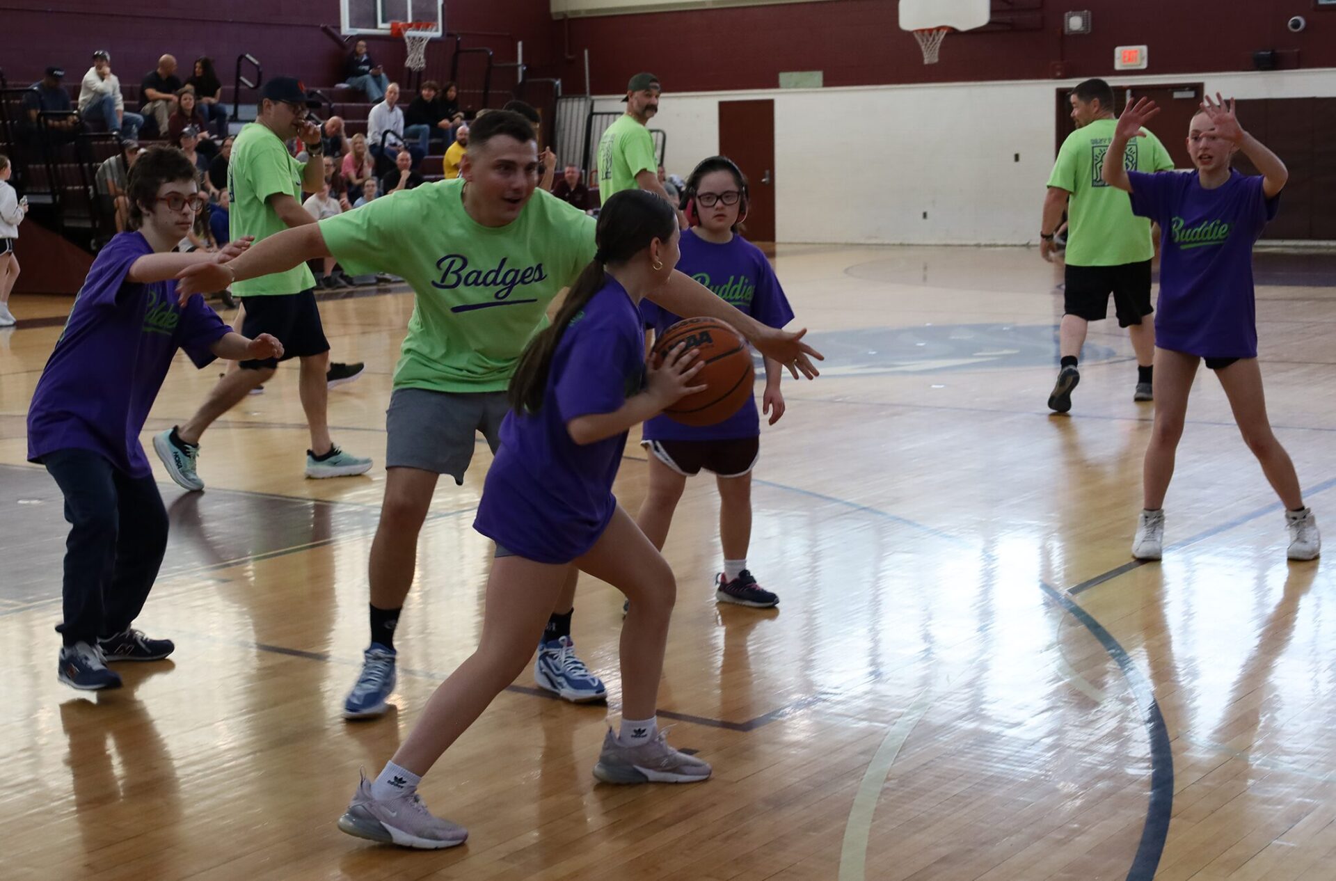 Action from the second annual Buddies vs. Badges charity basketball game on April 16, 2026.