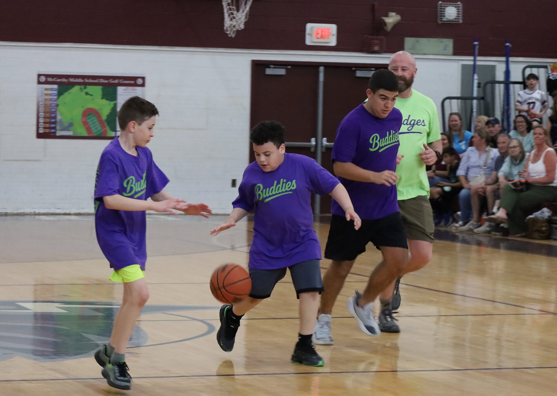 Action from the second annual Buddies vs. Badges charity basketball game on April 16, 2026.