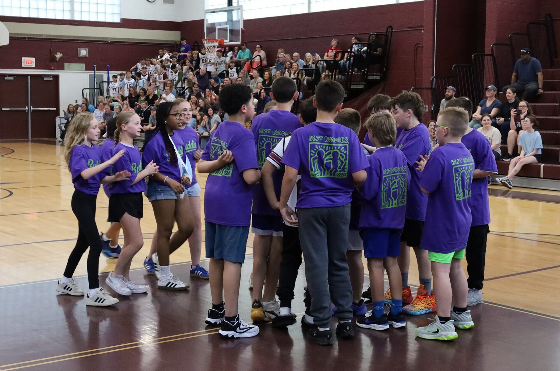 Members of the Parker Middle School Best Buddies basketball team celebrate victory following the second annual Buddies vs. Badges charity game on April 16, 2026.