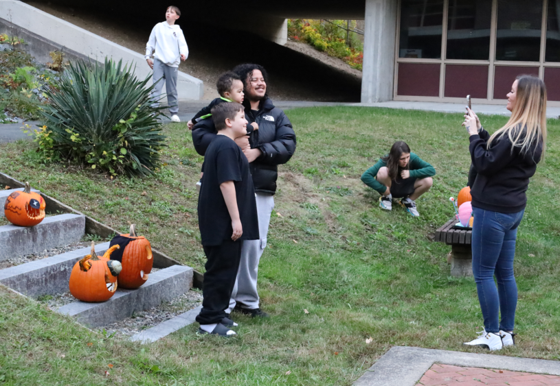 Students and their families attend the annual Pizza, Paperbacks and Pumpkins event at Parker Middle School on Wednesday, Oct. 21, 2026.